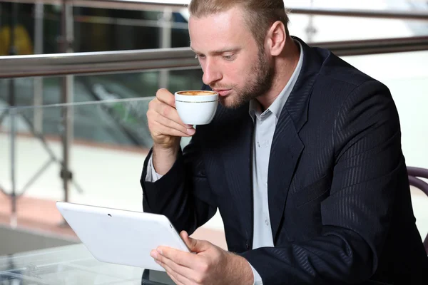 Young attractive businessman having lunch — Stock Photo, Image