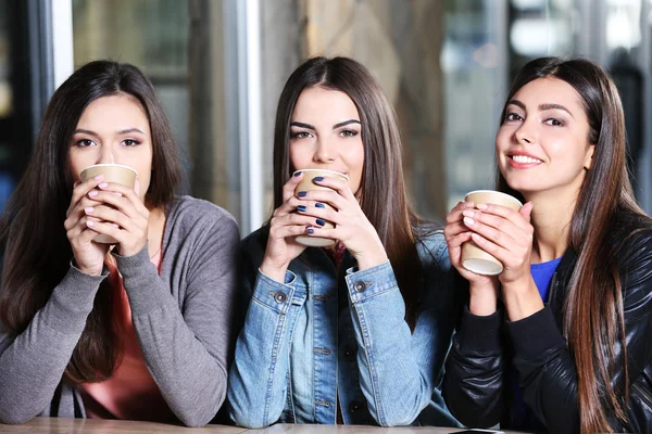 Friends together sitting at cafes terrace — Stock Photo, Image