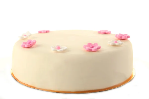 加糖蛋糕粘贴上白色孤立的花朵 — 图库照片