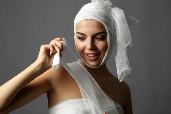 Young  woman with a gauze bandage — Stock Photo, Image