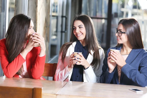 Girls pose with cup of coffee Stock Image