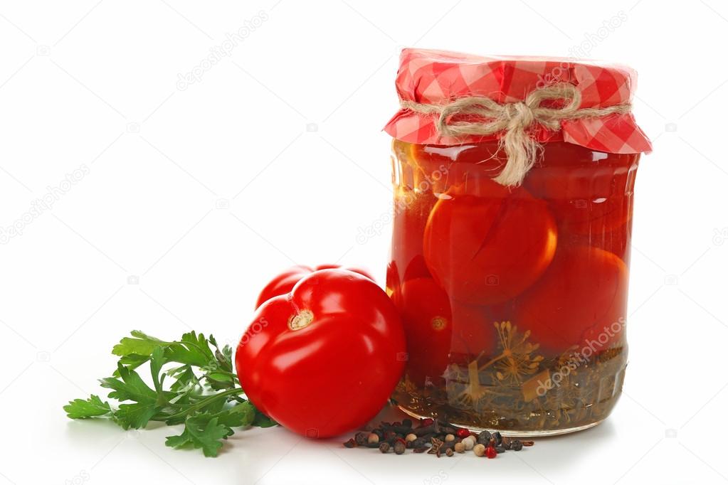 Jar of canned tomatoes isolated on white