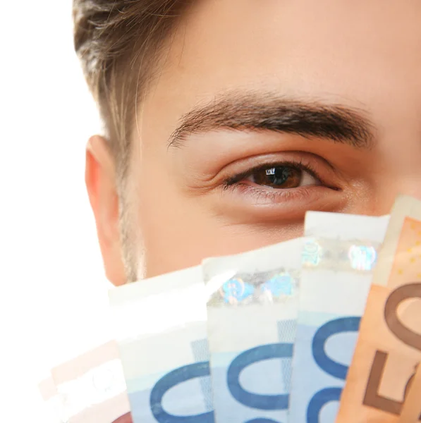 Man aanhouden van geld geïsoleerd op wit, close-up — Stockfoto