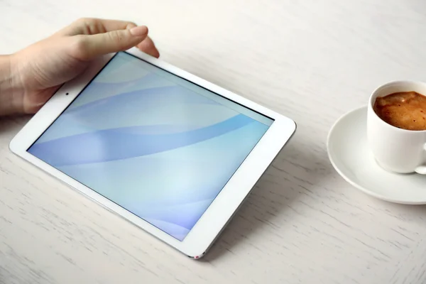 Woman using digital tablet on table close up — Stock Photo, Image