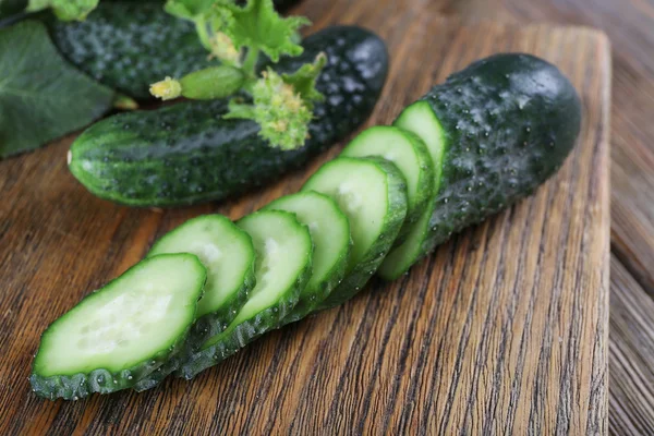 Cucumbers on wooden background, close up — Stock Photo, Image