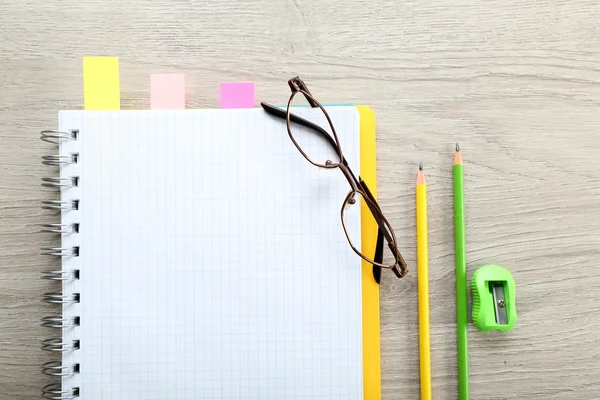 Opened notebook with stationery — Stock Photo, Image