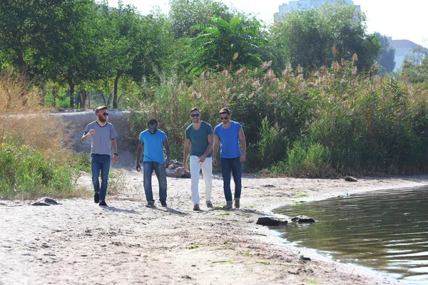 Young Men Walking Riverside — Stock Photo, Image