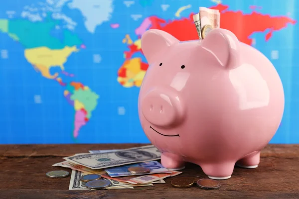 Piggy money box, banknotes and coins