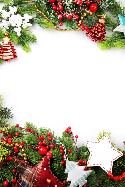 Christmas tree branch with red berries and decorations on white background — Stock Photo, Image