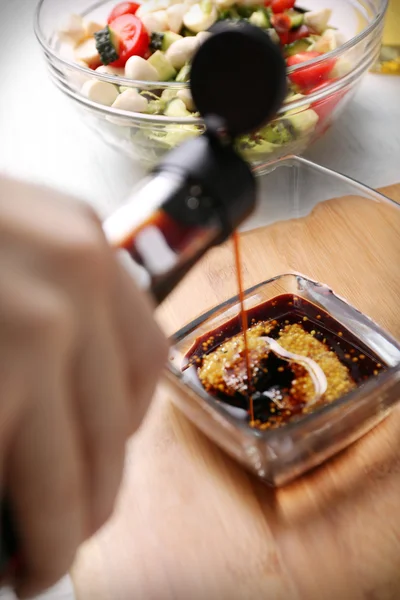 Process of preparing sauce for salad, at kitchen — Stock Photo, Image