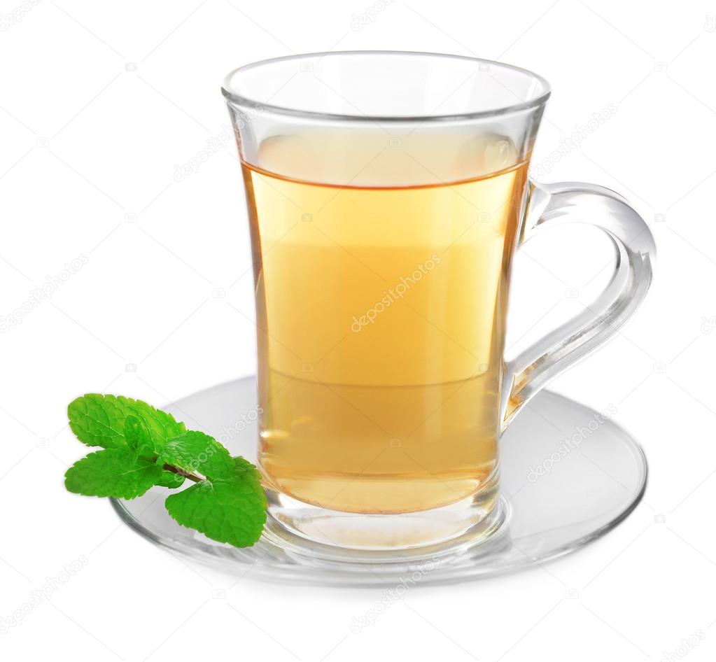 Glass cup of tea with mint leaves isolated on white background