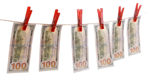 Concept of money laundering - dollars are drying on cord isolated on white background — Stock Photo, Image