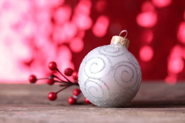 Christmas ball on abstract shiny background — Stock Photo, Image