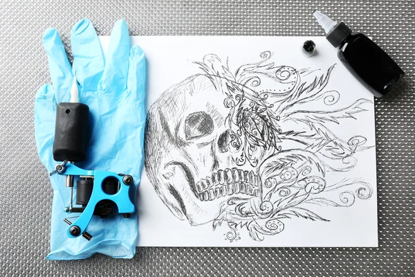 Tattoo machine, sketch and tattoo supplies, close up — Stock Photo, Image