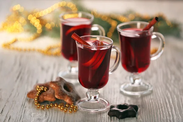 Mulled wine with cookies on wooden table — Stock Photo, Image