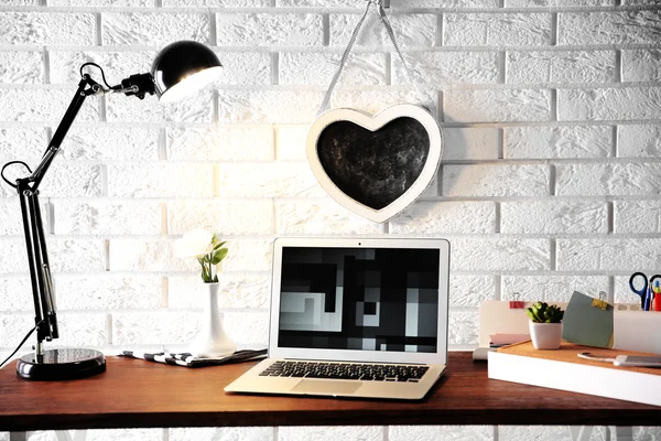Modern lamp and laptop — Stock Photo, Image