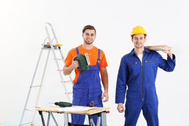 Two workers renewing apartment indoor clipart