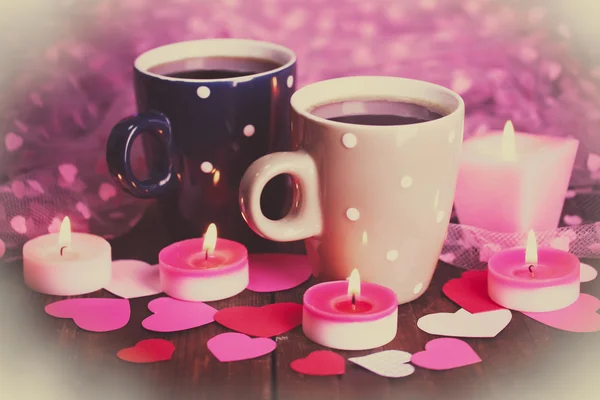 Two cups on table on lights background — Stock Photo, Image