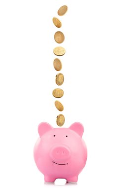 Bozuk paralarla dolu pembe kumbara.