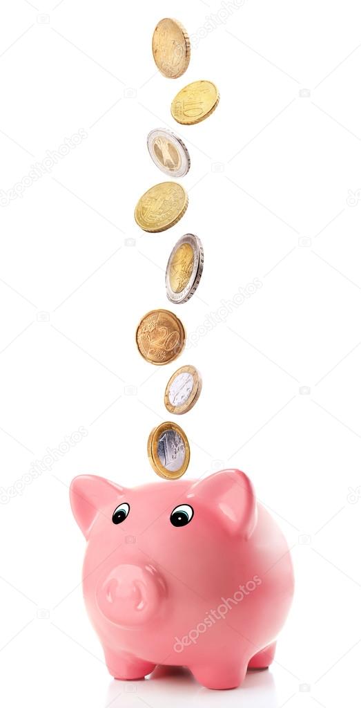 Pink piggy bank with coins
