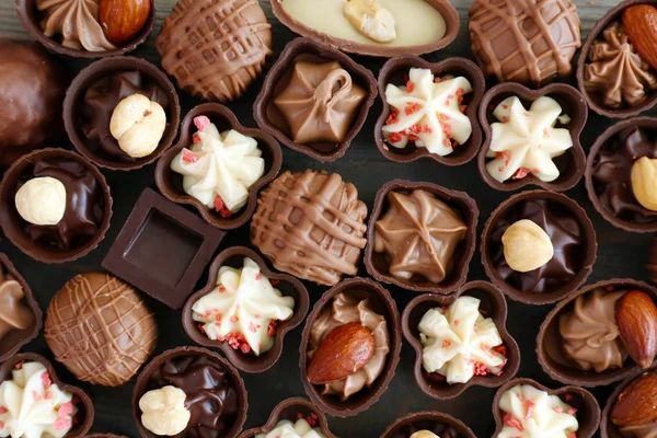 Délicieux chocolat bonbons fond, gros plan — Photo