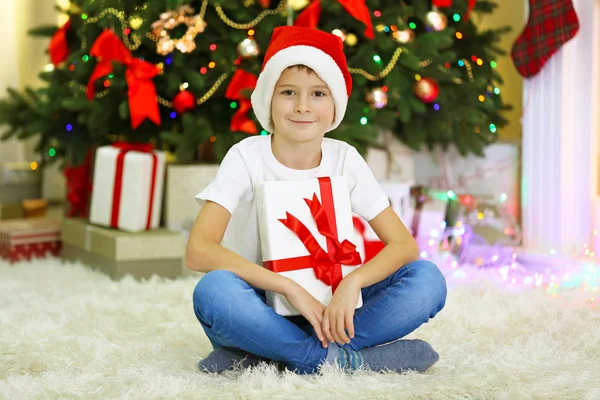 Funny boy with gift boxes — Stock Photo, Image