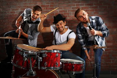 Musicians playing drums and guitar clipart