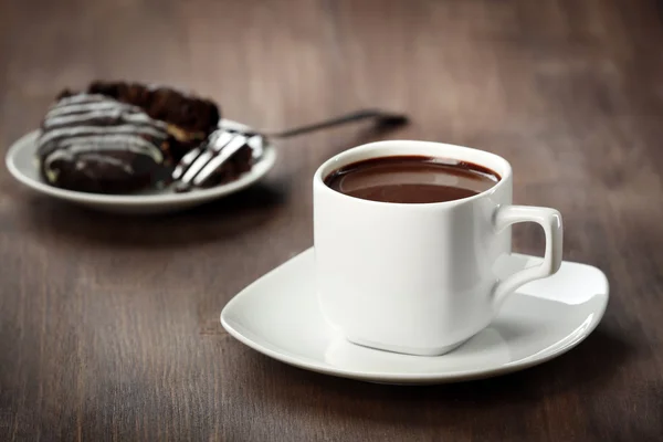 Cacao with biscuits on wooden table — Stock Photo, Image