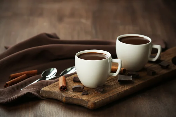 Cacao with sweets and cinnamon — Stock Photo, Image