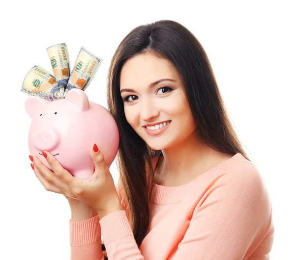 Woman with money box and banknotes in it isolated on white — Stock Photo, Image