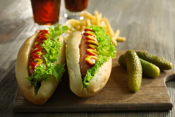 Delicious hot-dogs with pickled cucumbers — Stock Photo, Image