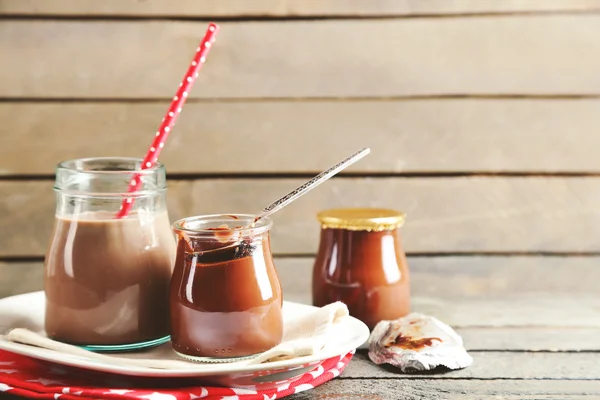 Chocolate dessert in a small glass jars — Stock Photo, Image