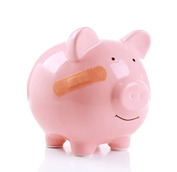 Piggy bank met zelfklevend verband — Stockfoto