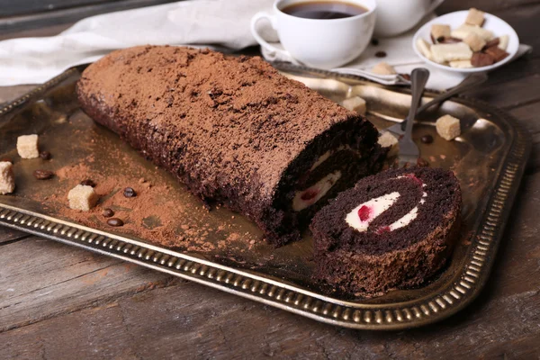 Chocolate roll with cream and berries on table close up — Stock Photo, Image