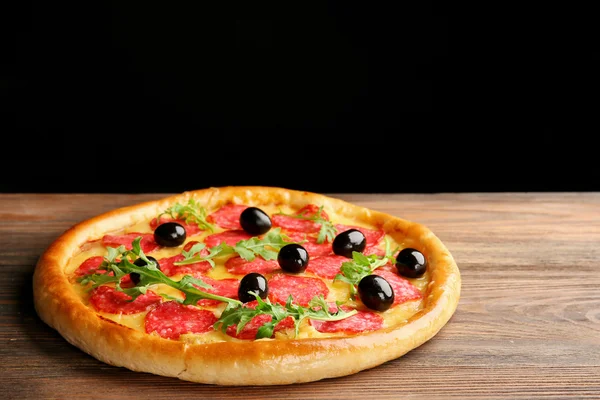 Tasty pizza with salami and olives — Stock Photo, Image