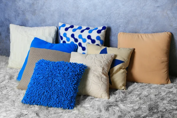 Decorative pillows on grey background — Stock Photo, Image