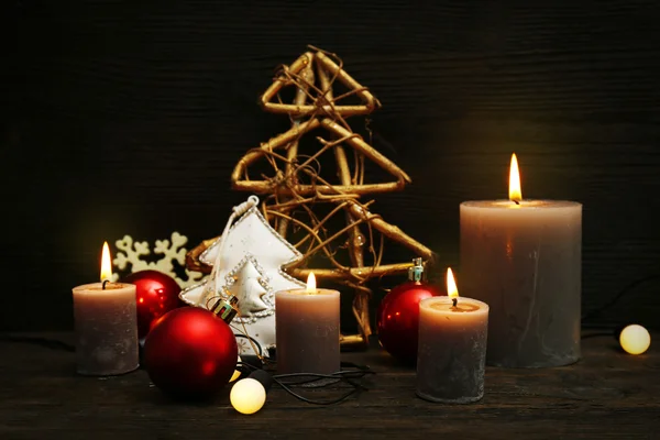 Burning candles with Christmas accessories — Stock Photo, Image