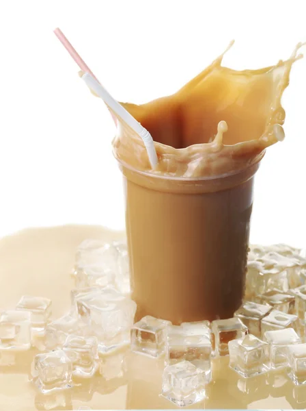 Cup of ice coffee with splashes — Stock Photo, Image
