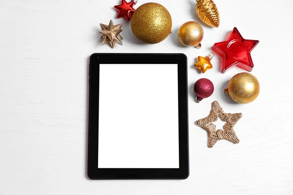 Tablet and Christmas decor — Stock Photo, Image