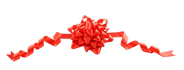 Red bow with curved ribbon isolated — Stock Photo, Image