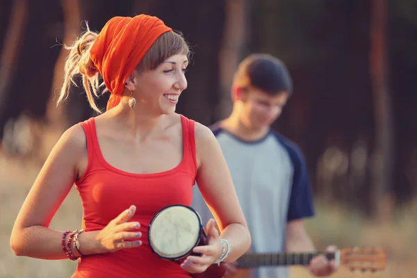 Woman playing djembe — Stock Photo, Image