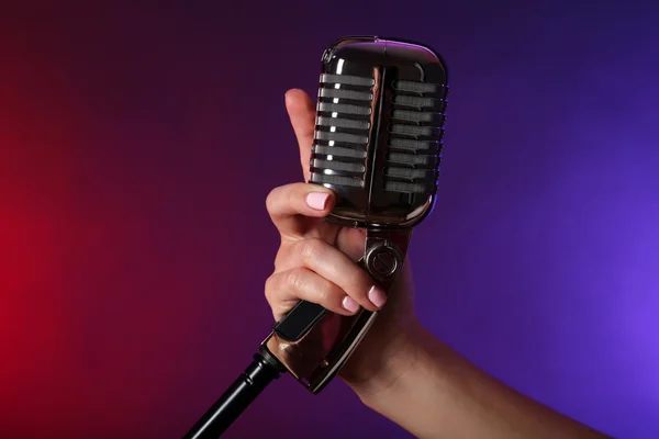 Hand holding retro microphone — Stock Photo, Image