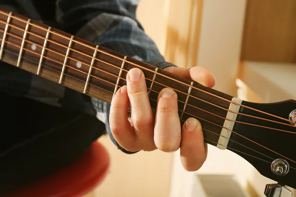 Close up view on playing guitar — Stock Photo, Image