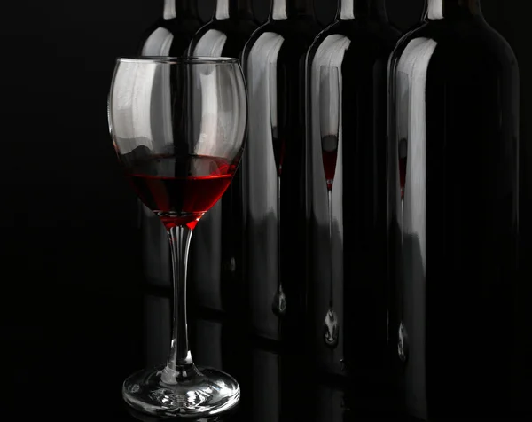 Wine bottles in a row — Stock Photo, Image