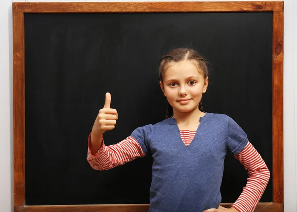 Girl showing thumbs up — Stock Photo, Image