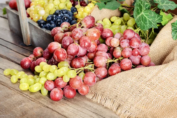 Grape in wooden box on a table — Stock Photo, Image