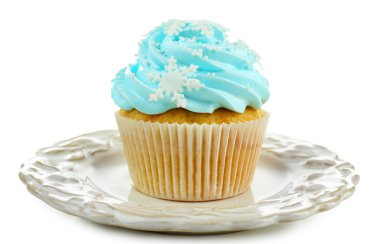 Blue cupcake on plate isolated on white