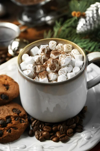 Mug of hot chocolate with marshmallows, fir tree branch on wooden background — Stock Photo, Image