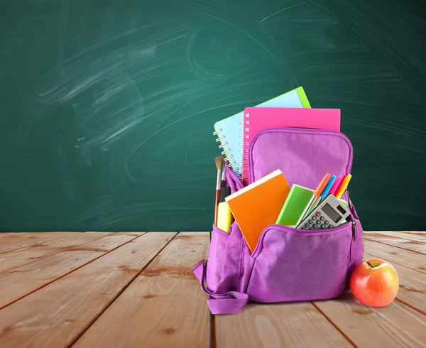 Backpack with school supplies — Stock Photo, Image