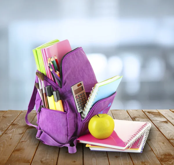 School backpack on  desk — Stock Photo, Image